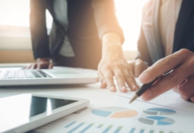 Executives_reviewing_quality_graphs
