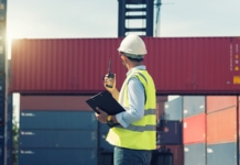 man, containers, hard hat